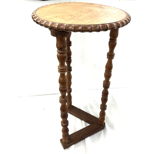 378 - Three legged table measures approximately 25 inches tall by 13.5 inches