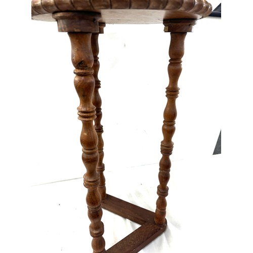 378 - Three legged table measures approximately 25 inches tall by 13.5 inches