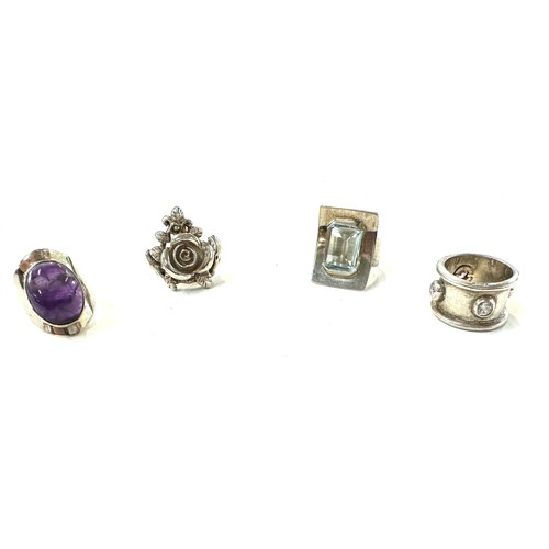 507 - 4 Silver rings, 3 stone set, Sizes L, N, M, total overall weight 29.9g