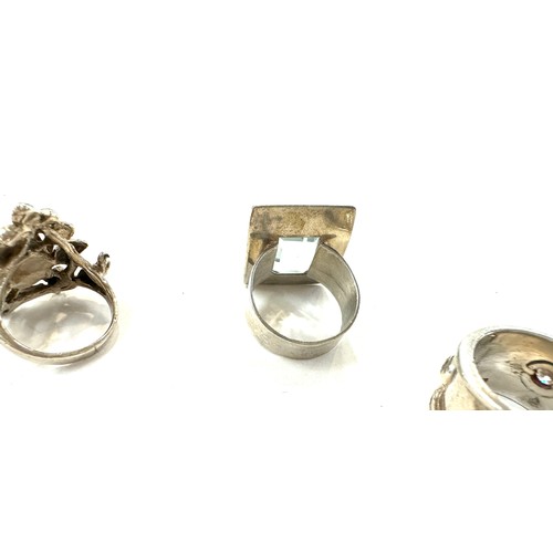 507 - 4 Silver rings, 3 stone set, Sizes L, N, M, total overall weight 29.9g