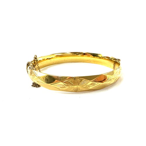 510 - Rolled gold bangle with 10 year guarantee, total approximate weight 31.1g