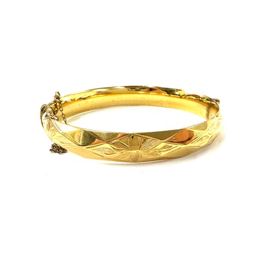 510 - Rolled gold bangle with 10 year guarantee, total approximate weight 31.1g