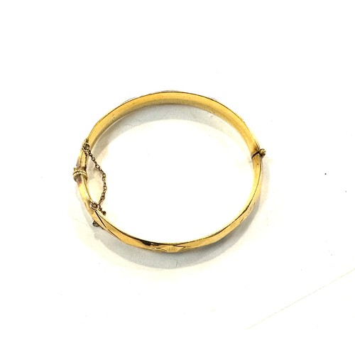 510 - Rolled gold bangle with 10 year guarantee, total approximate weight 31.1g