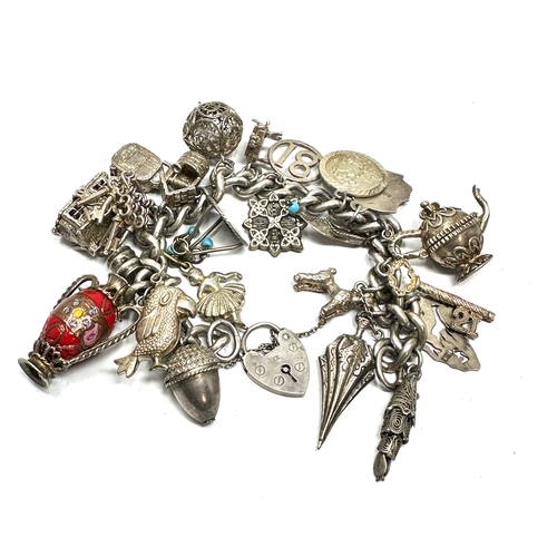 270 - Vintage silver charm bracelet inc opening charms weight 96g