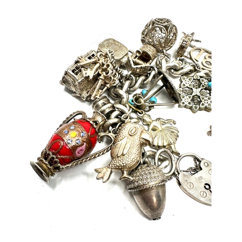 270 - Vintage silver charm bracelet inc opening charms weight 96g