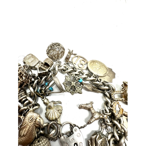 270 - Vintage silver charm bracelet inc opening charms weight 96g