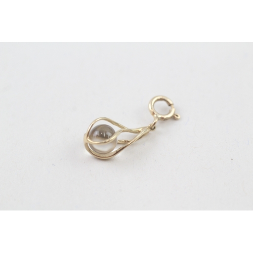 133 - 9ct gold caged rock crystal orb pendant (0.9g)