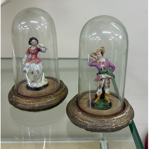 462 - Pair of porcelain miniature fugures under glass domes, one dome a/f