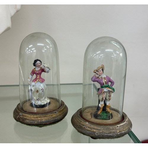 462 - Pair of porcelain miniature fugures under glass domes, one dome a/f