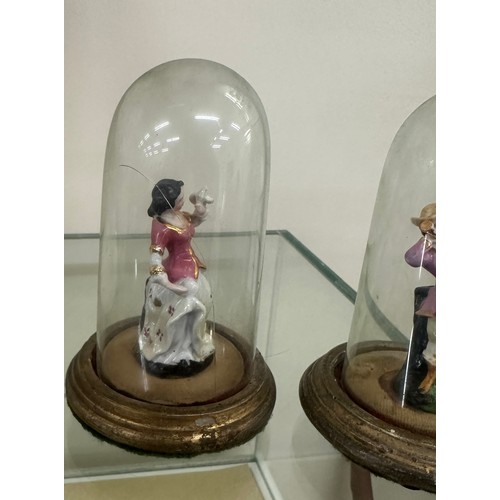 462 - Pair of porcelain miniature fugures under glass domes, one dome a/f