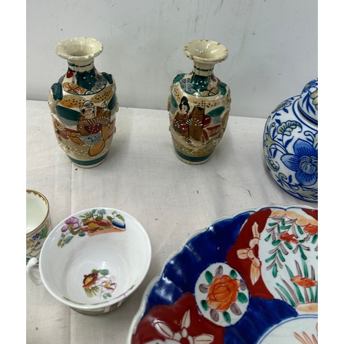 312 - Selection of oriental pottery includes charger, vases etc