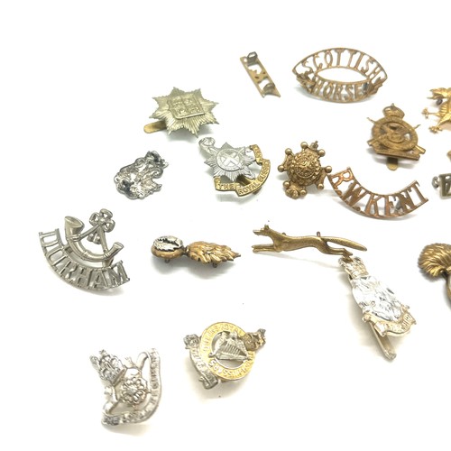 517 - Selection of military cap badges