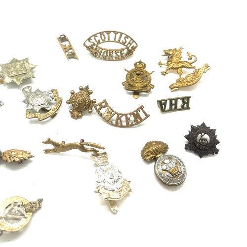 517 - Selection of military cap badges