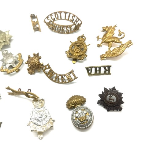 517 - Selection of military cap badges