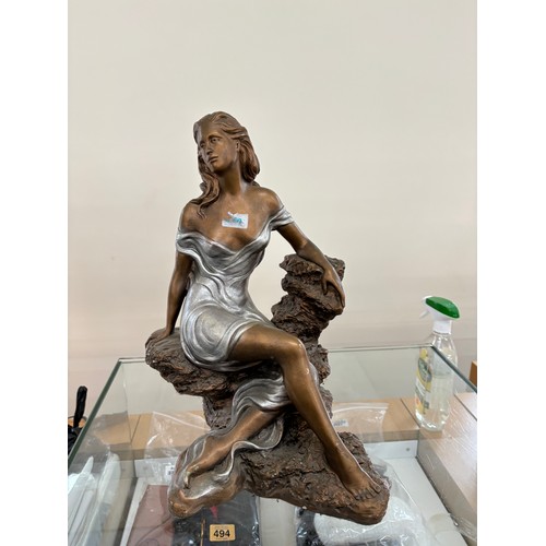 25 - Signed lady figure measures approximately 17.5 inches