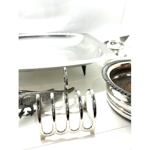 589 - Selection of silver plated items includes Tray, pheasant, toast rack etc