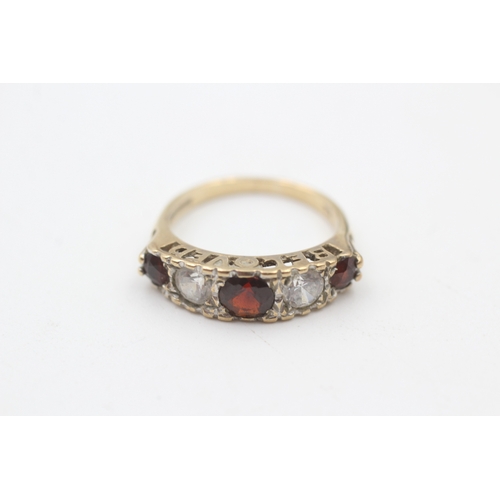 110 - 9ct gold vintage garnet and cubic zirconia gypsy set dress ring (2.5g)