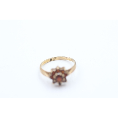 115 - 9ct gold garnet halo ring (1.3g)