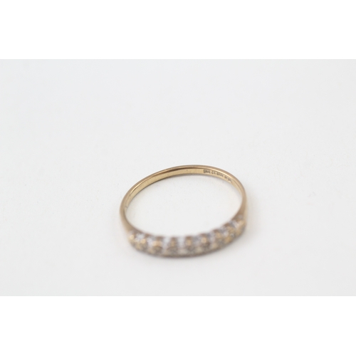 125 - 9ct gold diamond single row ring (1.2g)