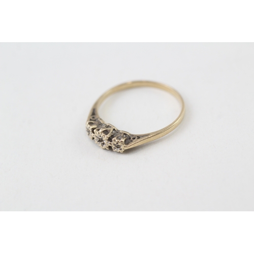 128 - 9ct gold three diamond ring (1.3g)