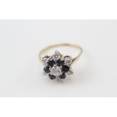 129 - 9ct gold sapphire and white gemstone ring (3.5g)