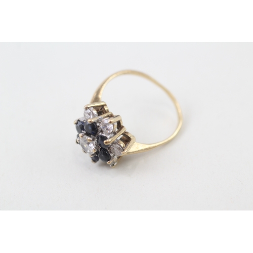 129 - 9ct gold sapphire and white gemstone ring (3.5g)