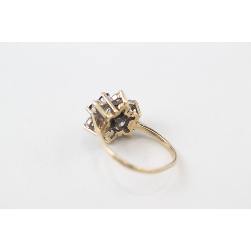 129 - 9ct gold sapphire and white gemstone ring (3.5g)