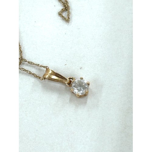 486 - 9ct gold chain with a stone set pendant total weight 0.9 grams