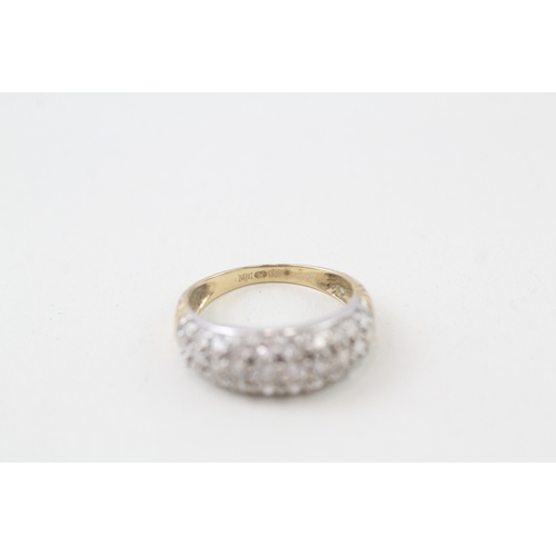 143 - 9ct gold cubic zirconia set bombe shaped band ring (2.1g)