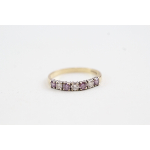 157 - 9ct gold white and purple cz set seven stone eternity ring (1.6g)