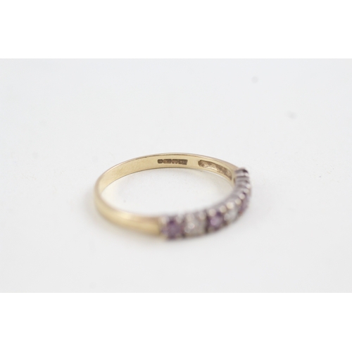 157 - 9ct gold white and purple cz set seven stone eternity ring (1.6g)