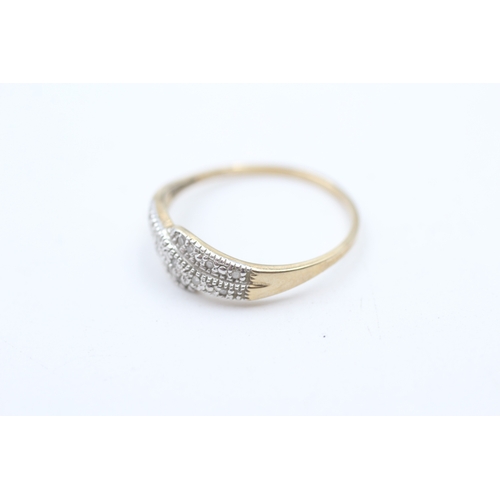 162 - 9ct gold diamond twist ring (1.3g)