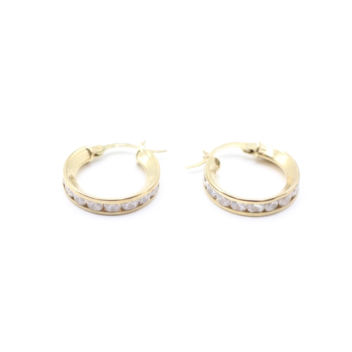 164 - 9ct gold cubic zirconia channel set hoop earrings (3.1g)