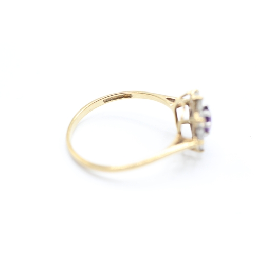 212 - 9ct gold amethyst and cubic zirconia floral cluster dress ring (1.4g)