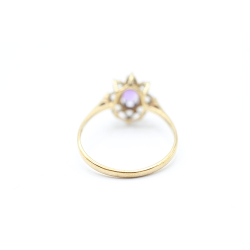 212 - 9ct gold amethyst and cubic zirconia floral cluster dress ring (1.4g)