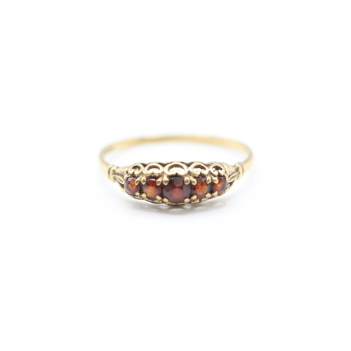 216 - 9ct gold vintage garnet five stone dress ring with openwork gallery (1.4g)