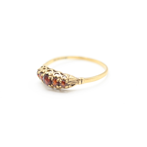 216 - 9ct gold vintage garnet five stone dress ring with openwork gallery (1.4g)