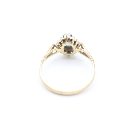 217 - 9ct gold vintage topaz and diamond halo dress ring (1.7g)