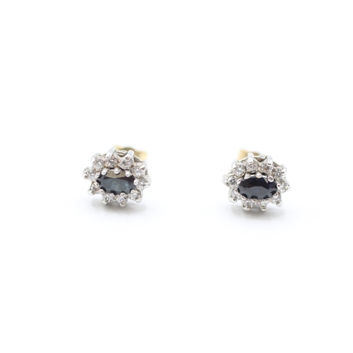 219 - 9ct gold sapphire and cubic zirconia halo stud earrings (1.5g)