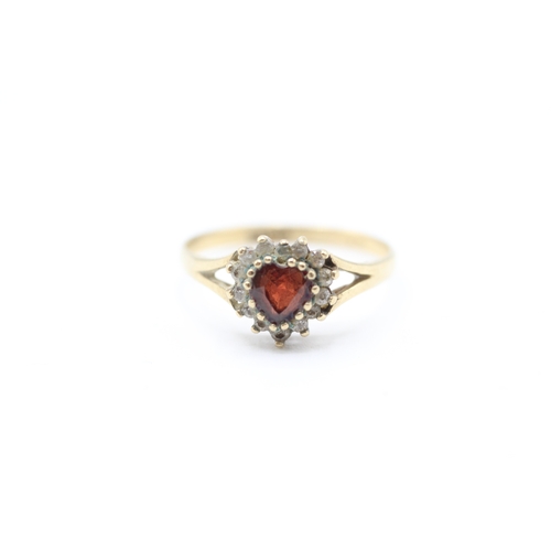 221 - 9ct gold heart cut garnet and cubic zirconia halo dress ring (1.6g)