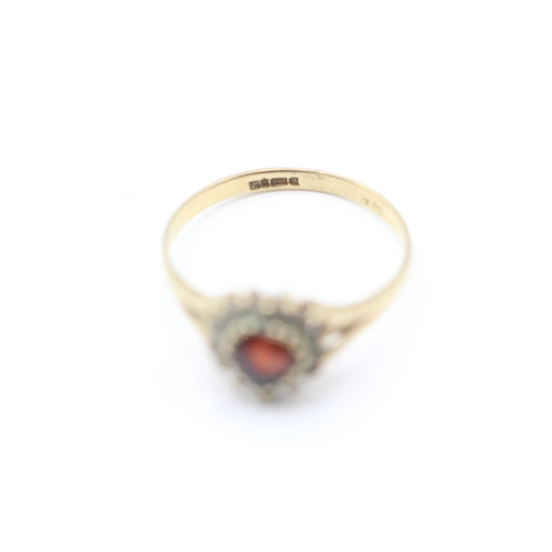 221 - 9ct gold heart cut garnet and cubic zirconia halo dress ring (1.6g)