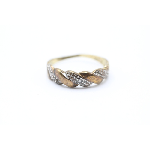 225 - 9ct gold diamond twist design dress ring (1.5g)