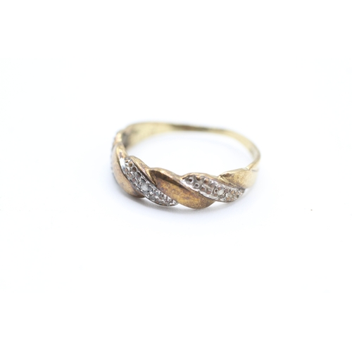 225 - 9ct gold diamond twist design dress ring (1.5g)