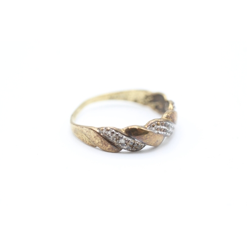 225 - 9ct gold diamond twist design dress ring (1.5g)