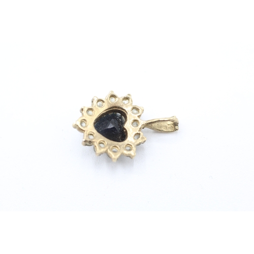 234 - 9ct gold heart cut sapphire and diamond halo pendant (1.4g)