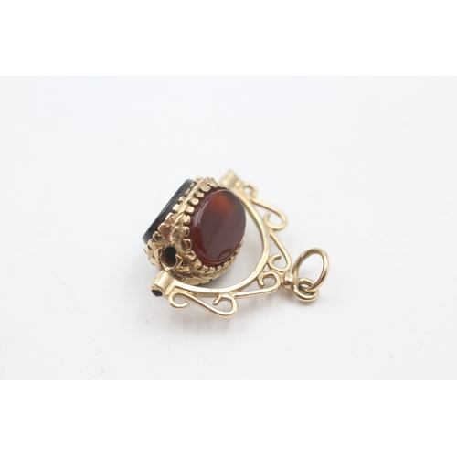 238 - 9ct gold vintage gemstone spinner fob inc. carnelian, bloodstone and onyx (3.1g)