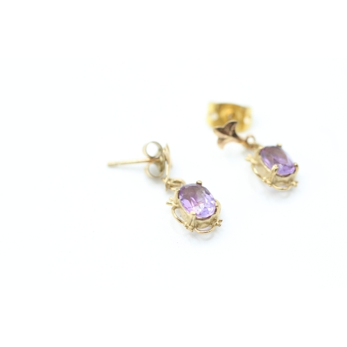 239 - 9ct gold oval cut amethyst drop earrings with posts (1g)