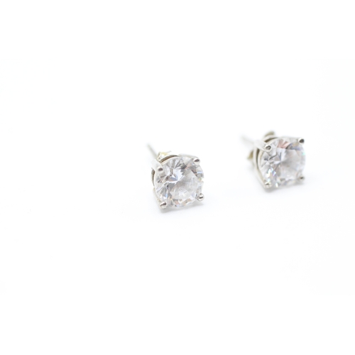 242 - 9ct white gold cubic zirconia solitaire stud earrings (1.6g)