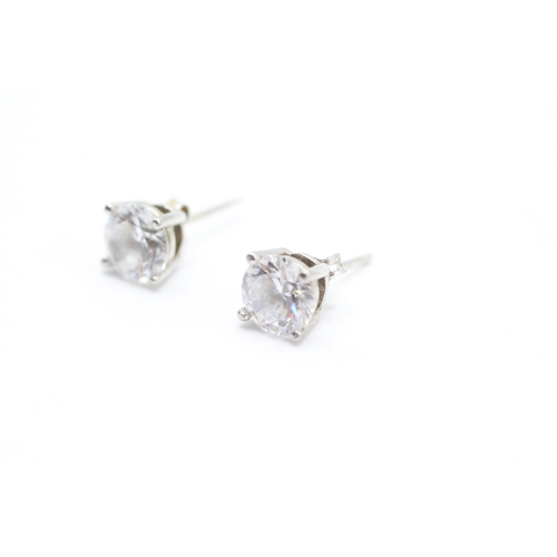 242 - 9ct white gold cubic zirconia solitaire stud earrings (1.6g)