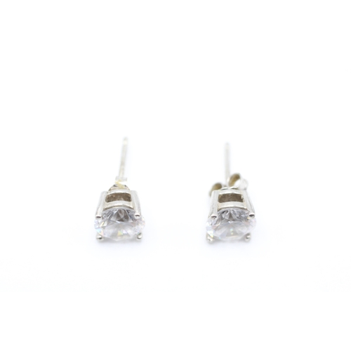 242 - 9ct white gold cubic zirconia solitaire stud earrings (1.6g)